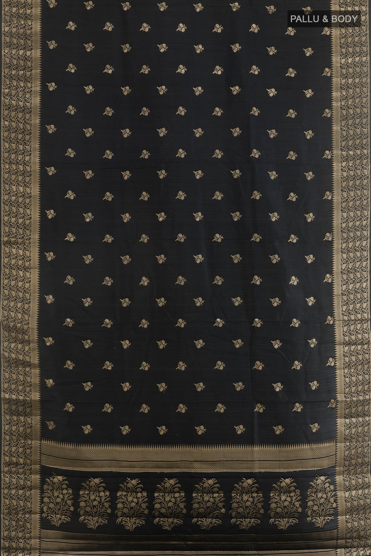 Flat view of Pure Silk Black Banarasi Raw Saree with Zari Butta on the body and Zari Border. 
