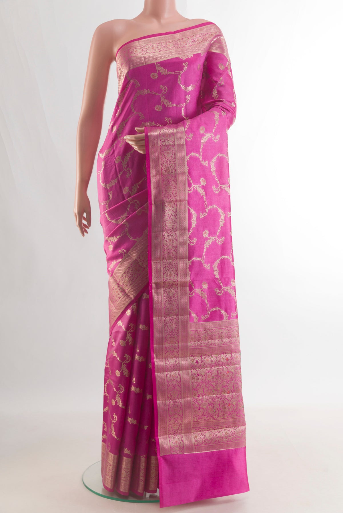 Pure Silk Pink Banarasi Raw Saree with Zari Brocade on the body and Zari Border.  displayed on a mannequin