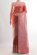 Orange Kanchipuram Tissue Saree with Zari Brocade on the body and Zari Border.  displayed on a mannequin