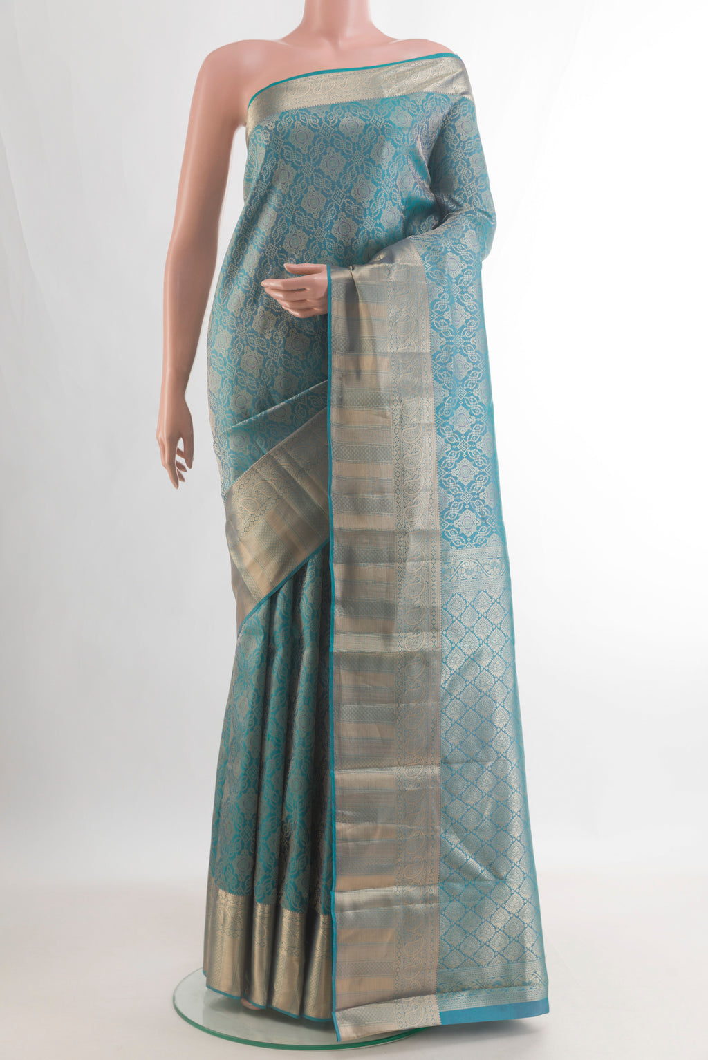Pure Silk Blue Kanjivaram Saree with Zari Brocade on the body and Zari Border.  displayed on a mannequin