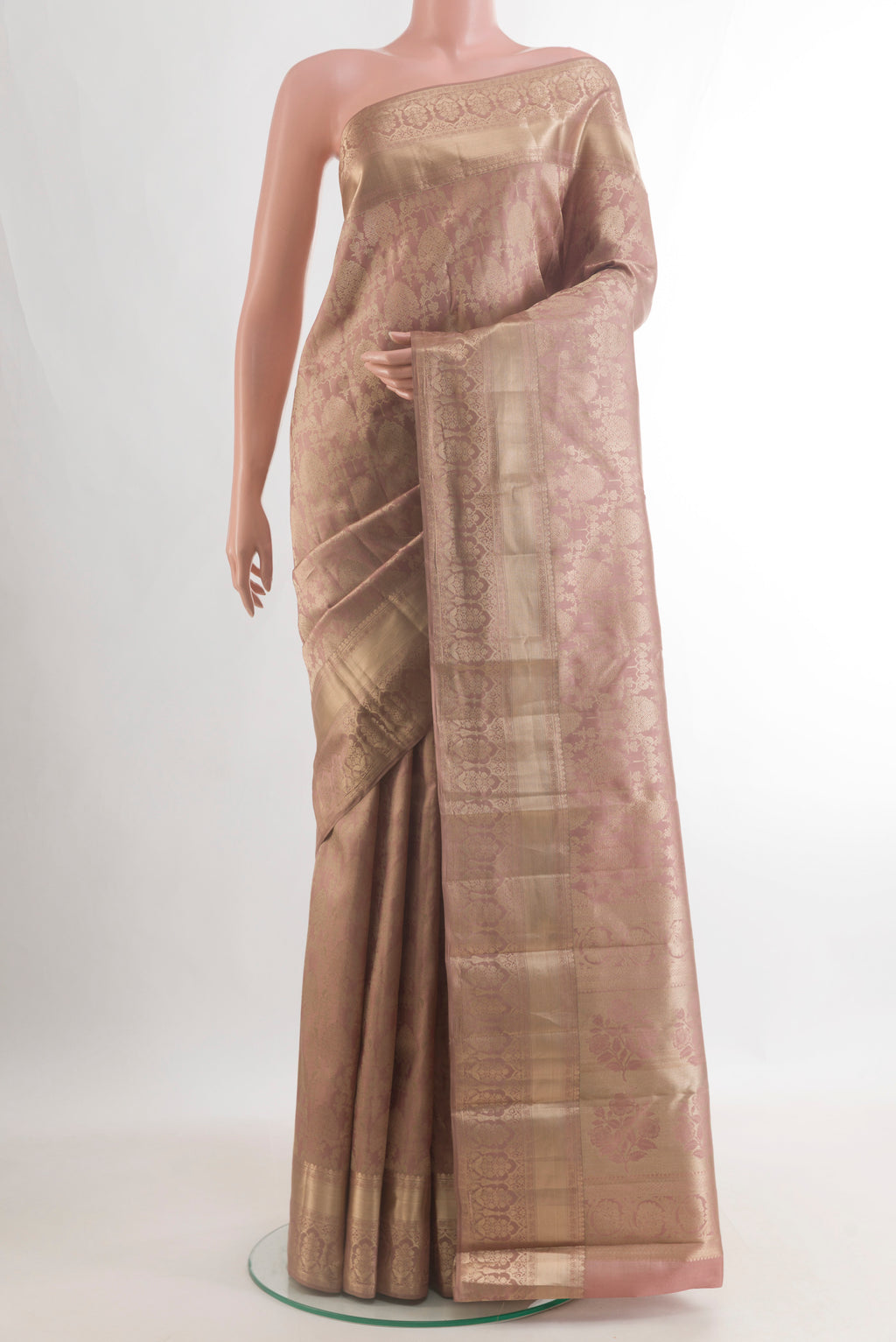 Pure Silk Peach Kanjivaram Saree with Zari Brocade on the body and Zari Border.  displayed on a mannequin