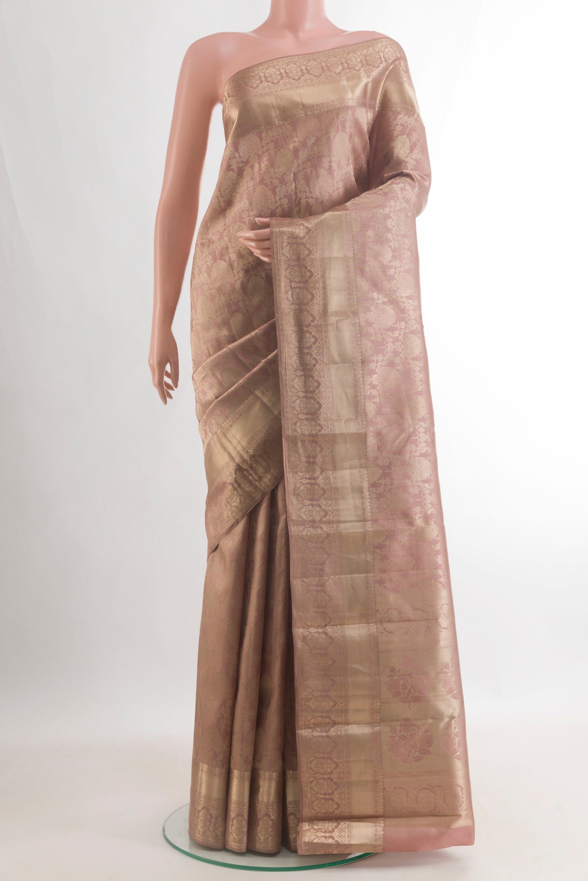 Pure Silk Peach Kanjivaram Saree with Zari Brocade on the body and Zari Border.  displayed on a mannequin