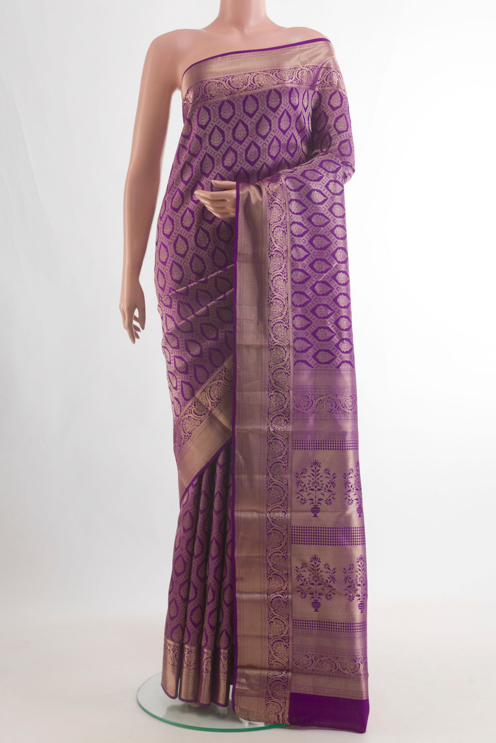 Pure Silk Purple Kanjivaram Saree with Zari Brocade on the body and Zari Border.  displayed on a mannequin