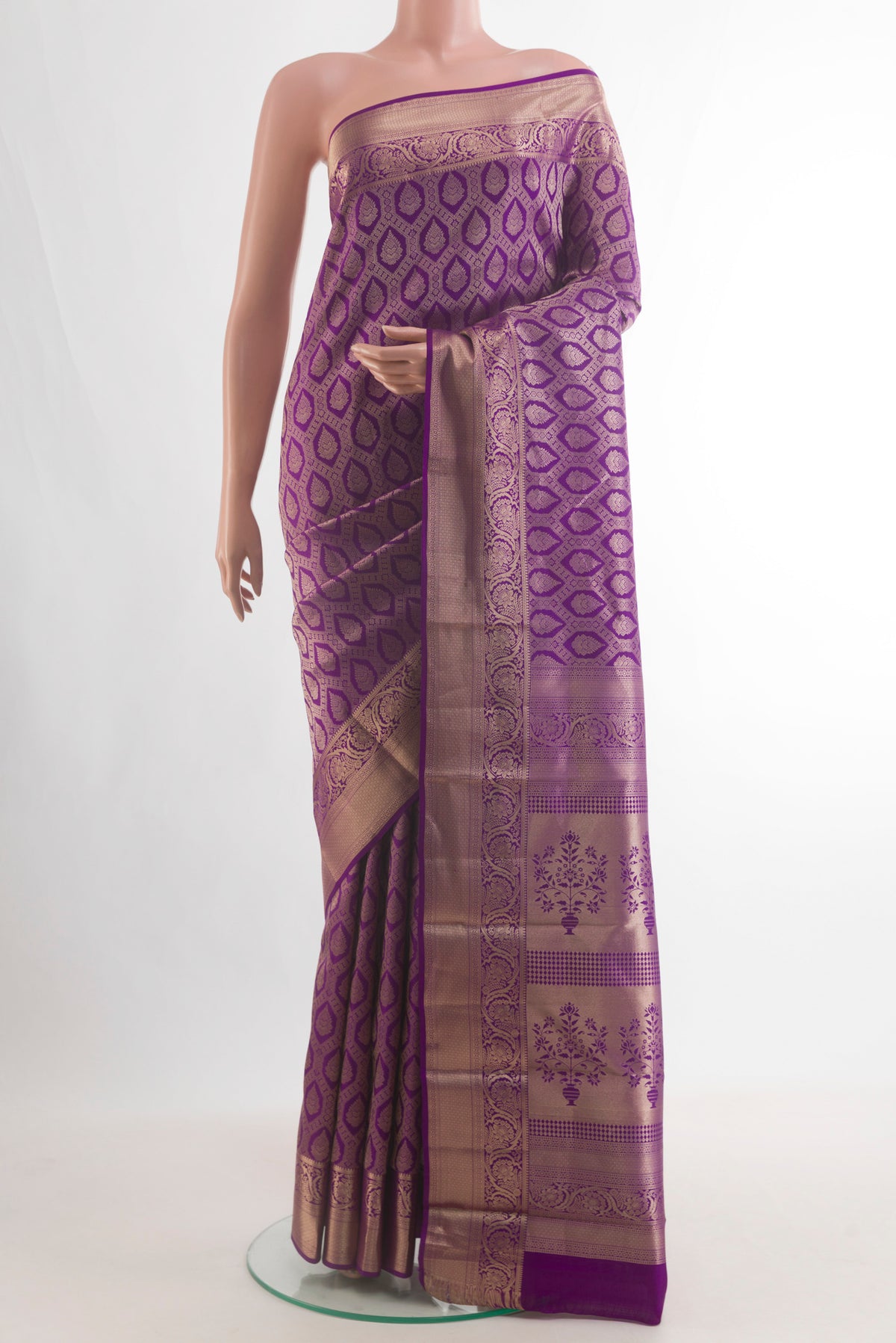 Pure Silk Purple Kanjivaram Saree with Zari Brocade on the body and Zari Border.  displayed on a mannequin