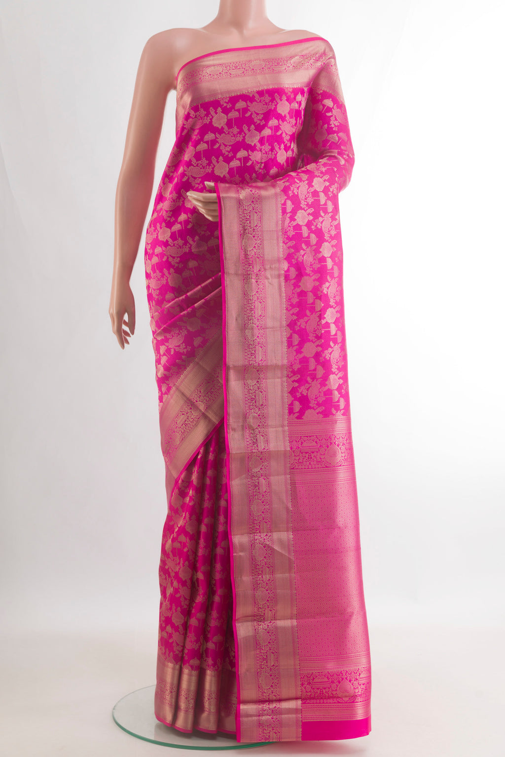 Pure Silk Pink Kanjivaram Saree with Zari Brocade on the body and Zari Border.  displayed on a mannequin