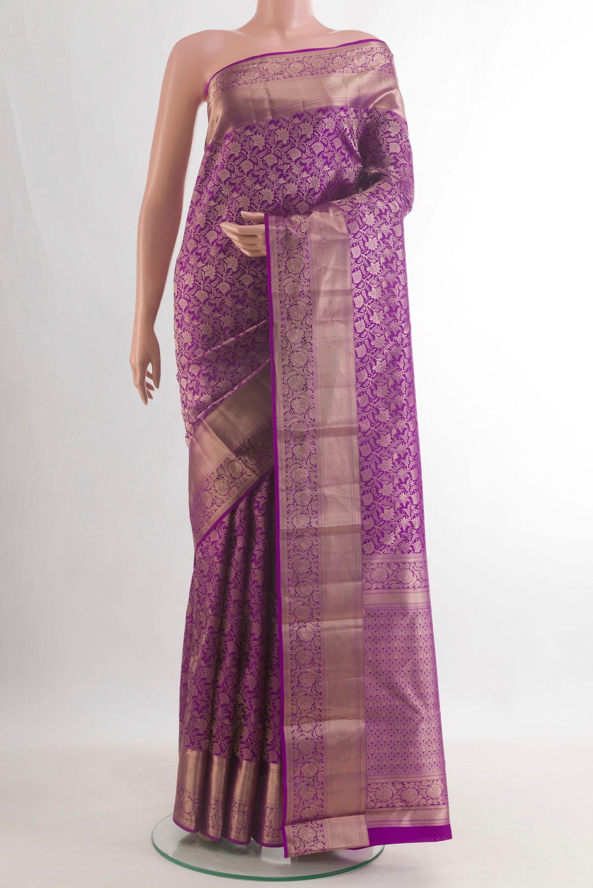 Pure Silk Purple Kanjivaram Saree with Zari Brocade on the body and Zari Border.  displayed on a mannequin