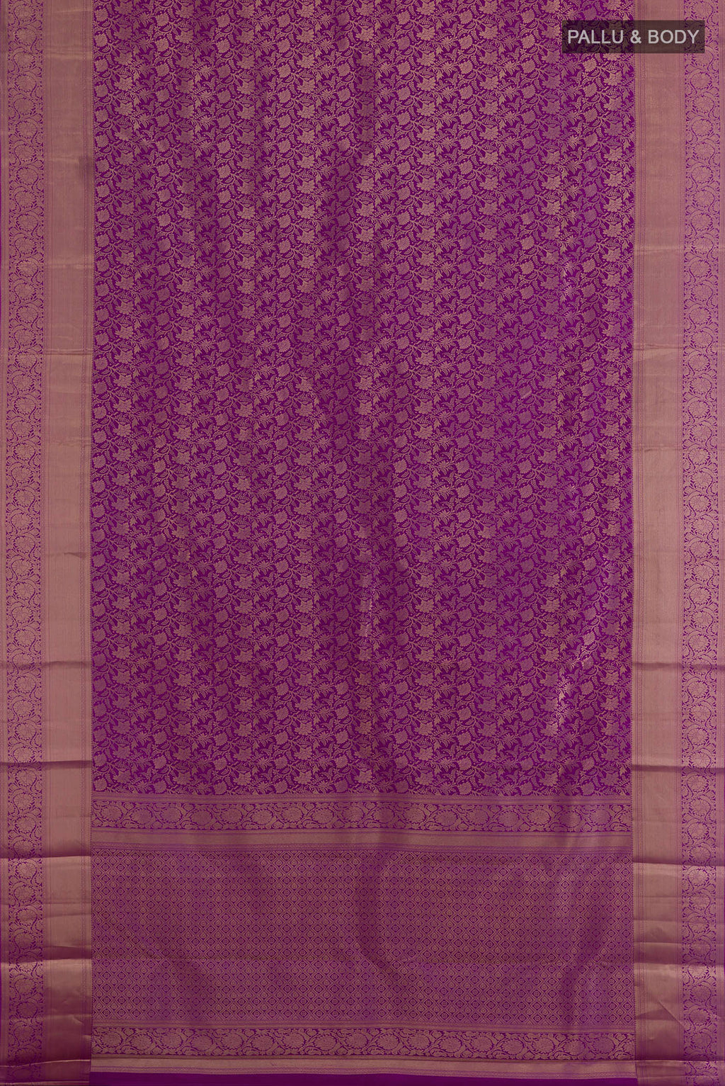 Flat view of Pure Silk Purple Kanjivaram Saree with Zari Brocade on the body and Zari Border. 