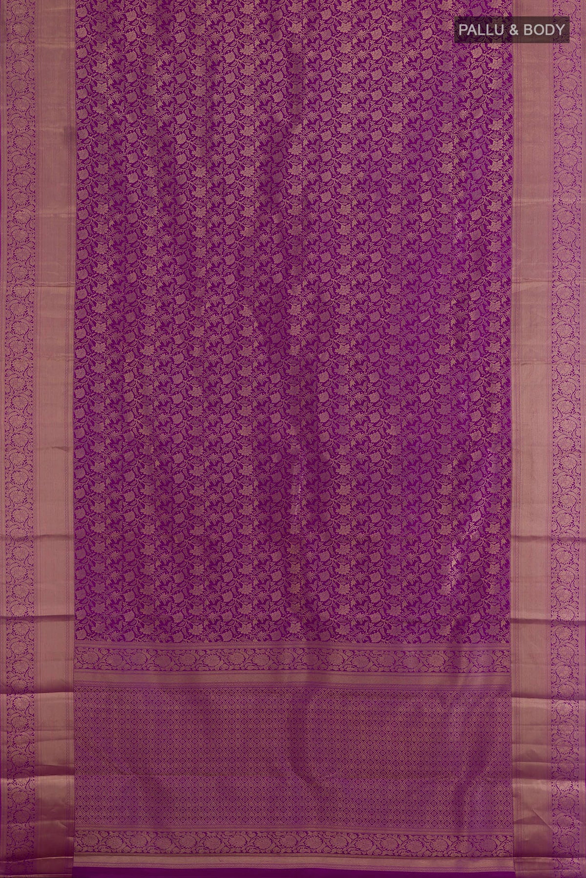 Flat view of Pure Silk Purple Kanjivaram Saree with Zari Brocade on the body and Zari Border. 