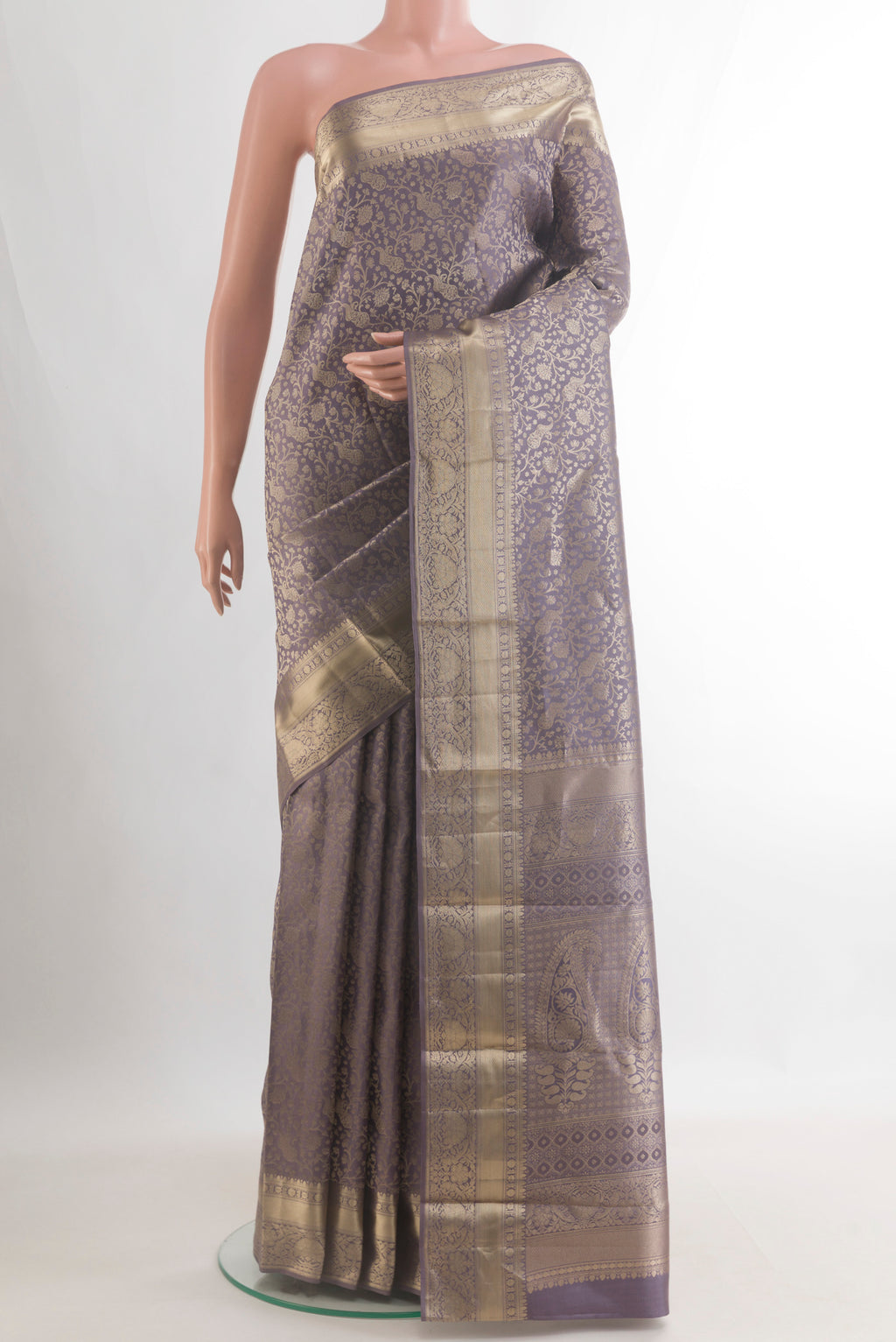 Pure Silk Grey Kanjivaram Saree with Zari Brocade on the body and Zari Border.  displayed on a mannequin