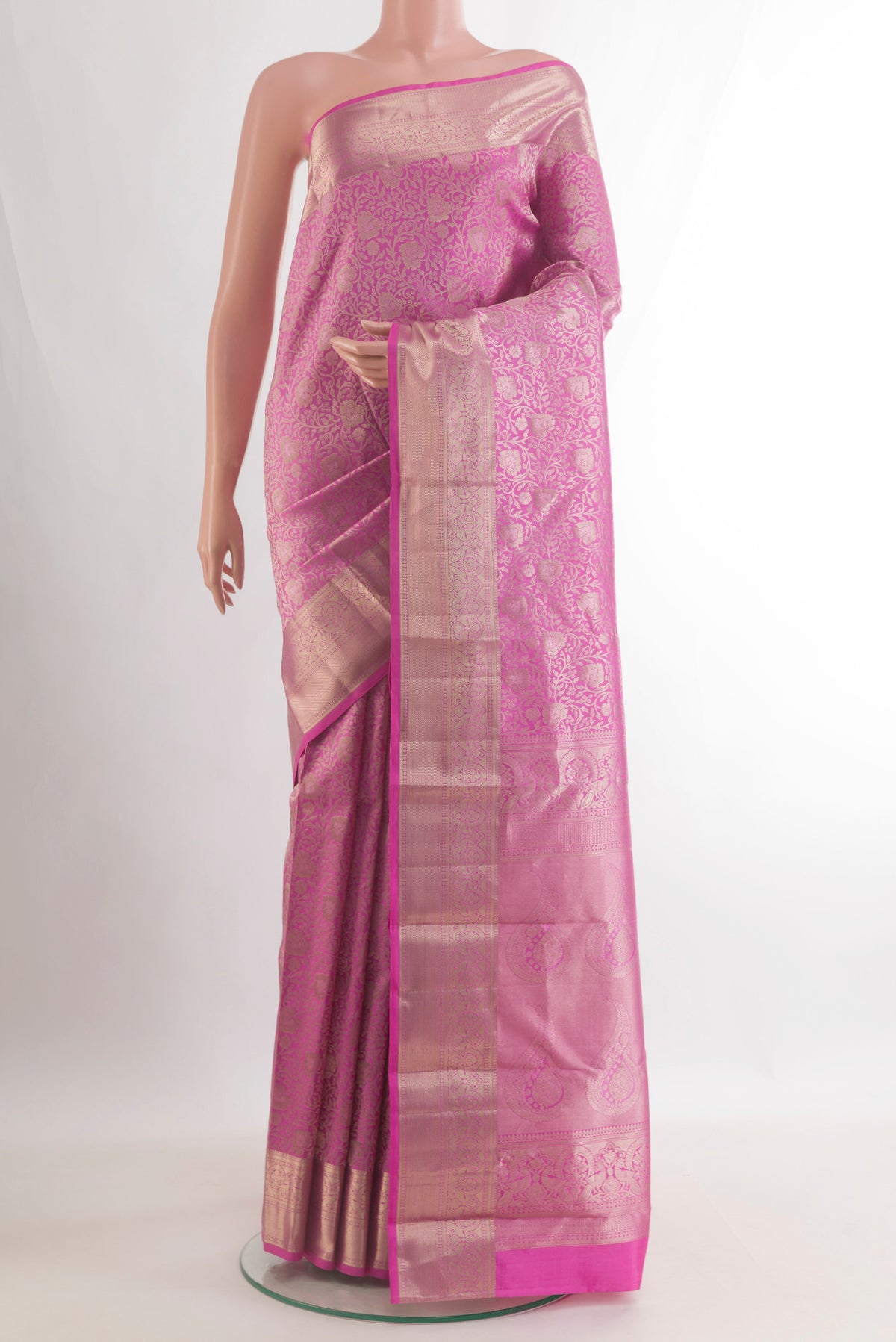 Pure Silk Pink Kanjivaram Saree with Zari Brocade on the body and Zari Border.  displayed on a mannequin