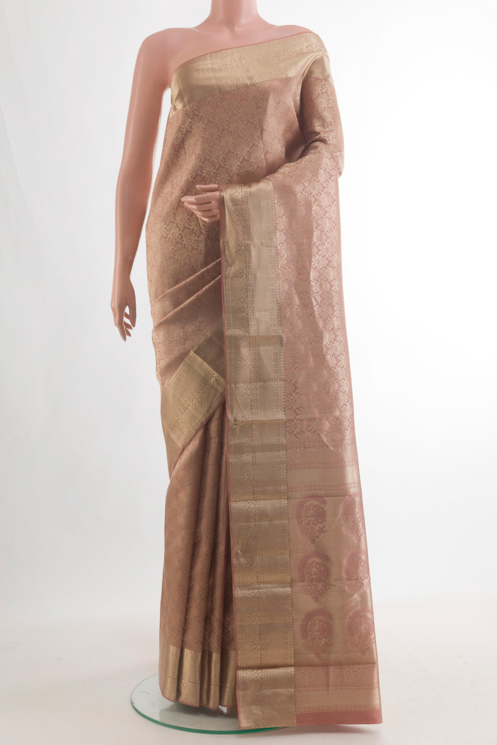 Pure Silk Golden Peach Kanjivaram Saree with Zari Brocade on the body and Zari Border.  displayed on a mannequin