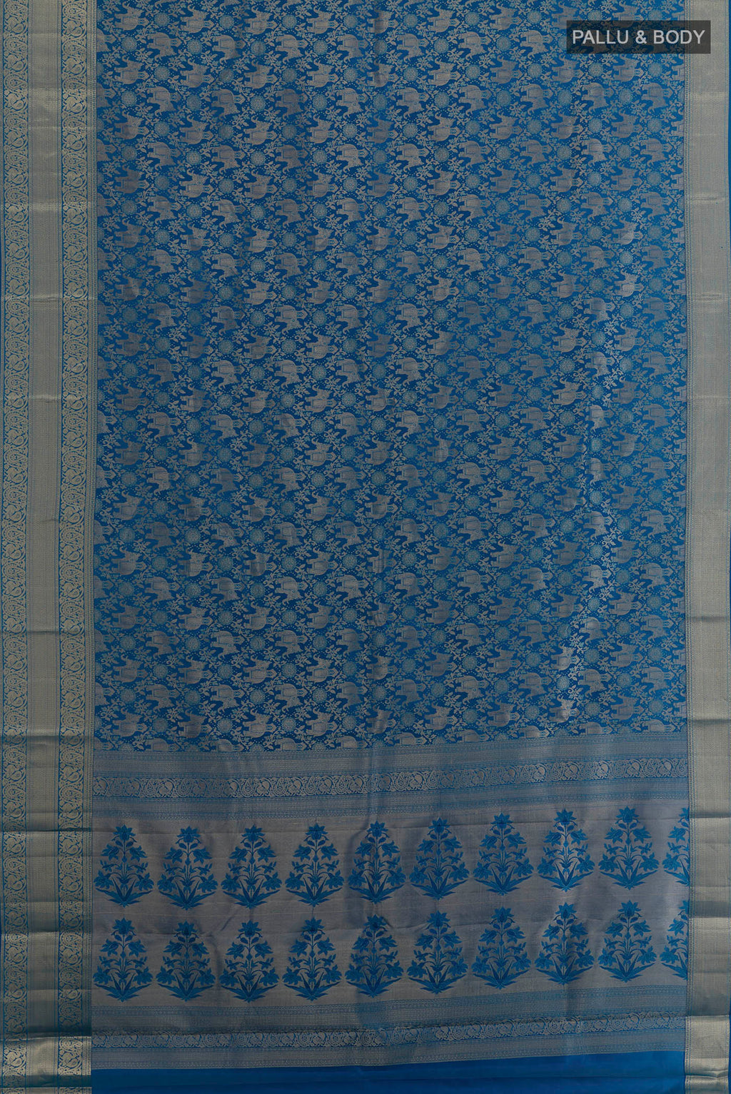 Flat view of Pure Silk Blue Dual Tone Kanjivaram Saree with Zari Brocade on the body and Zari Border. 