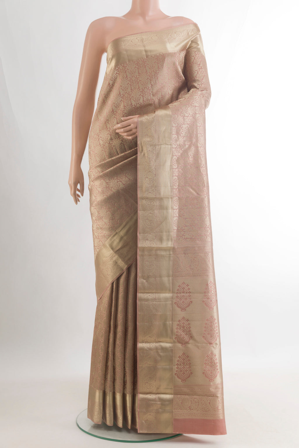 Pure Silk Beige Kanjivaram Saree with Zari Brocade on the body and Zari Border.  displayed on a mannequin