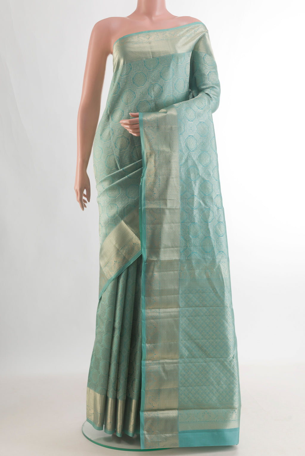 Pure Silk Sea Green Kanjivaram Saree with Zari Brocade on the body and Zari Border.  displayed on a mannequin