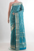 Pure Silk Blue Kanjivaram Saree with Zari Brocade on the body and Zari Border.  displayed on a mannequin