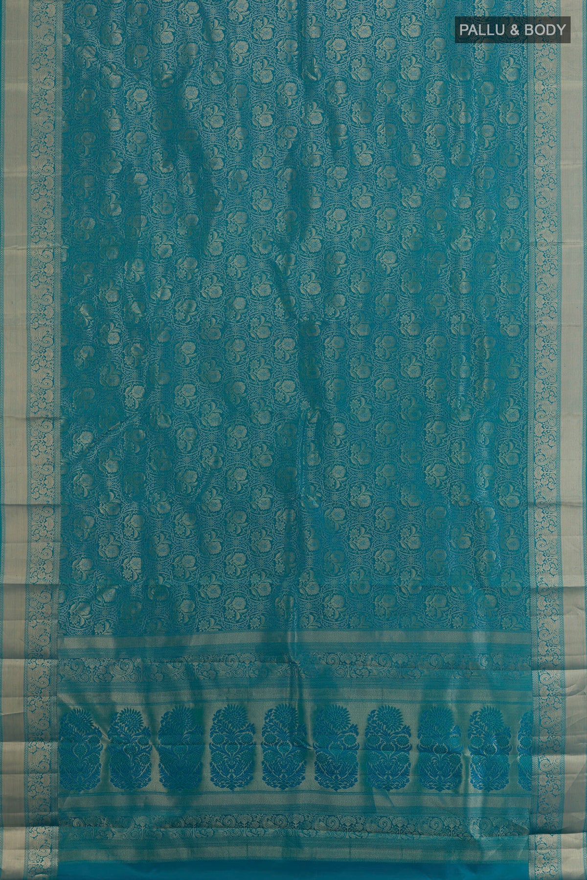 Flat view of Pure Silk Blue Kanjivaram Saree with Zari Brocade on the body and Zari Border. 