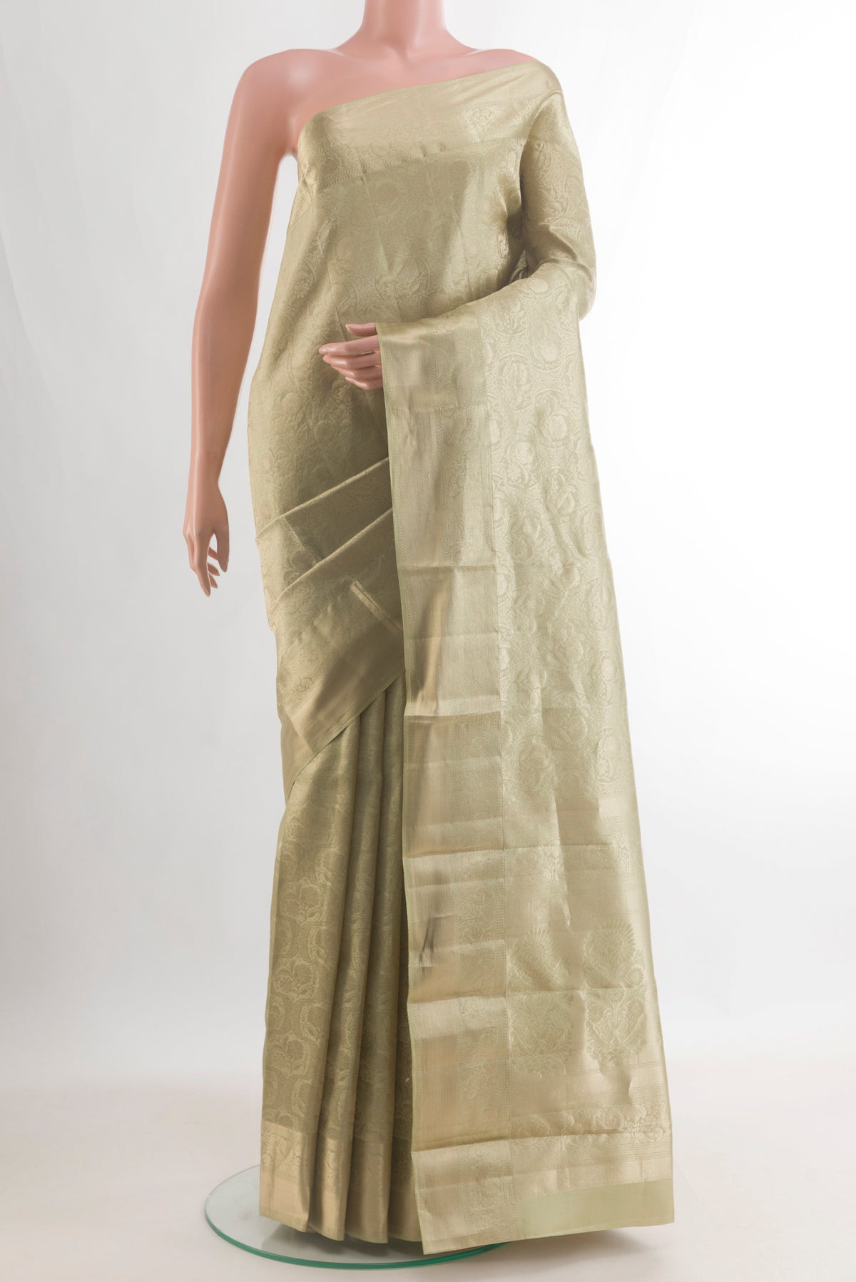 Pure Silk Sage Green Kanjivaram Saree with Zari Brocade on the body and Zari Border.  displayed on a mannequin