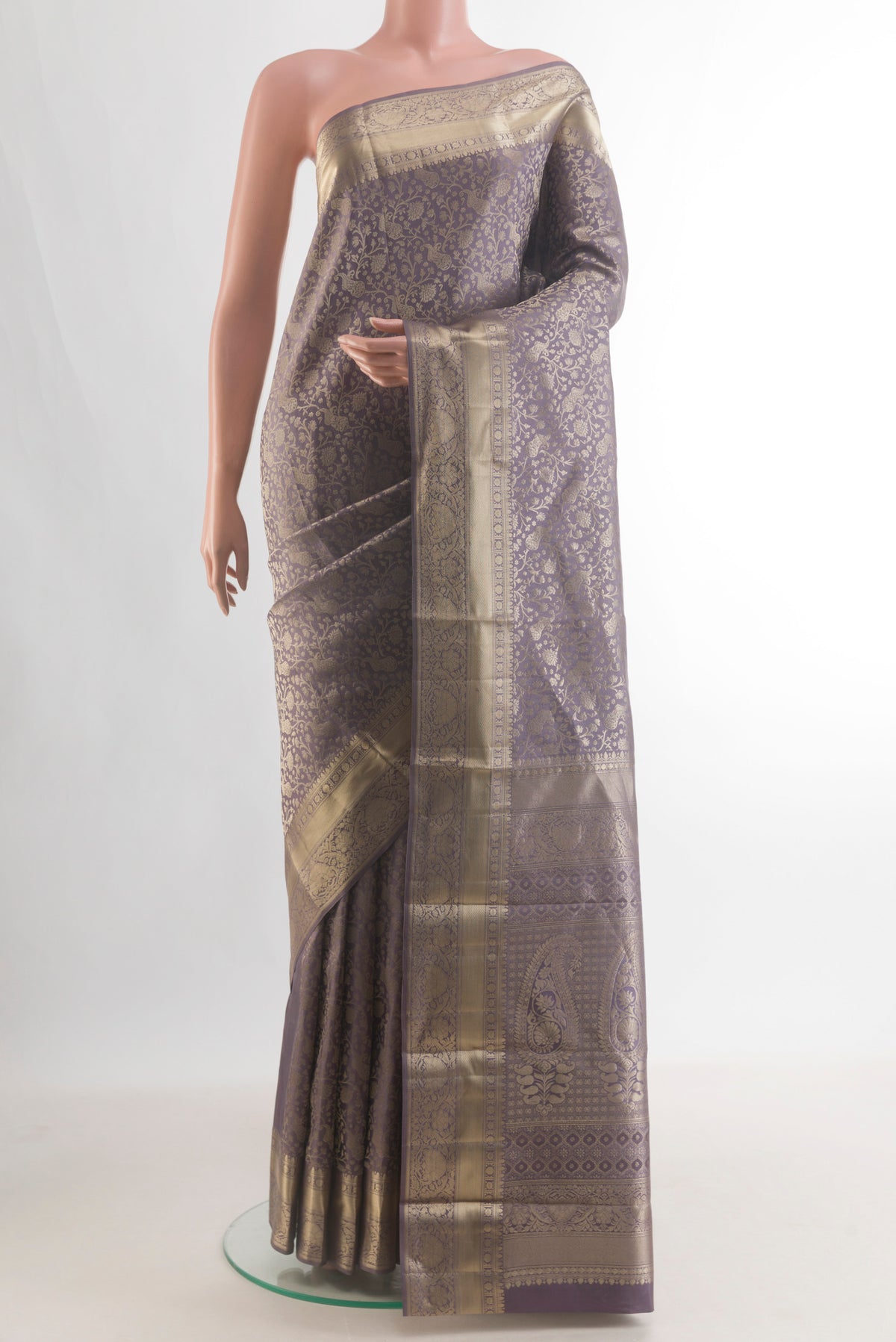 Pure Silk Grey Kanjivaram Saree with Zari Brocade on the body and Zari Border.  displayed on a mannequin
