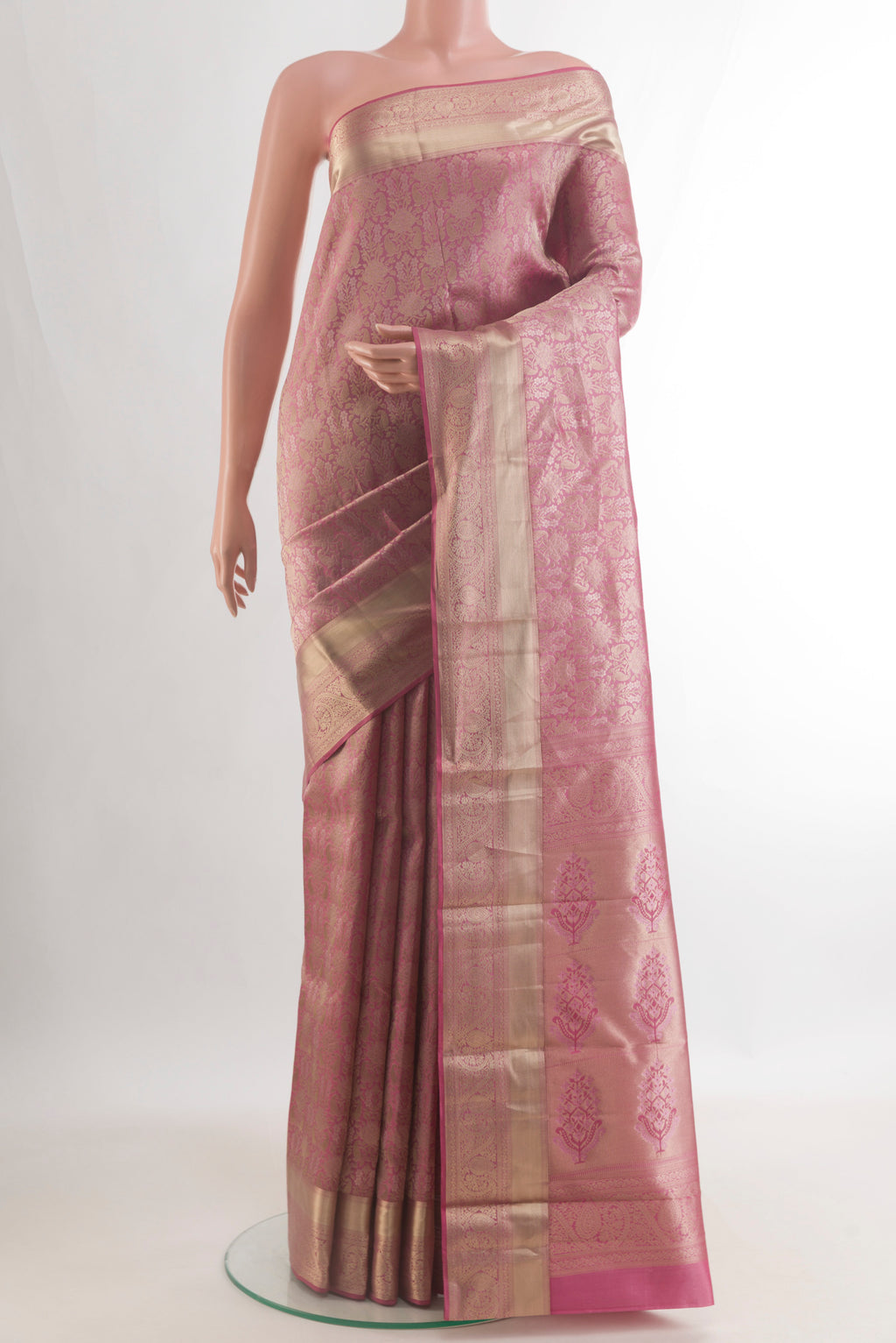 Pure Silk Pink Kanjivaram Saree with Zari Brocade on the body and Zari Border.  displayed on a mannequin