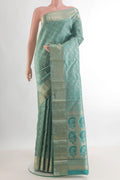 Pure Silk Turquoise Kanjivaram Saree with Zari Brocade on the body and Zari Border.  displayed on a mannequin