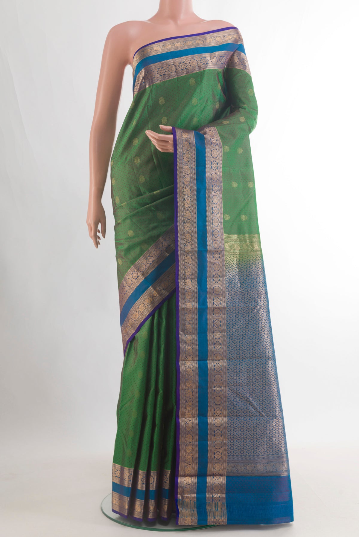 Pure Silk Green Kanjivaram Saree with Jacquard With Zari Butta on the body and Zari Border.  displayed on a mannequin