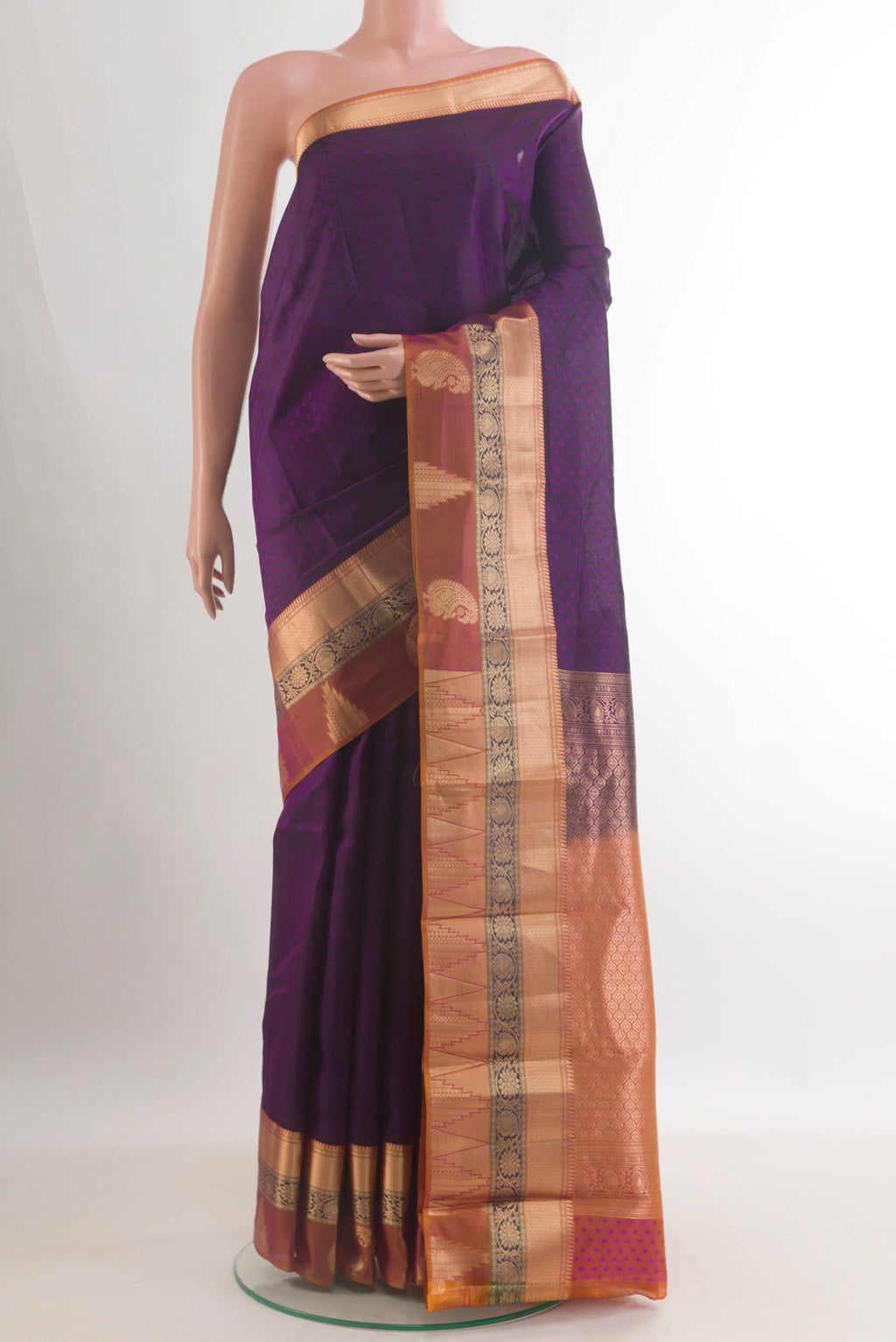 Pure Silk Purple Kanjivaram Saree with Jacquard design on the body and Zari Border.  displayed on a mannequin