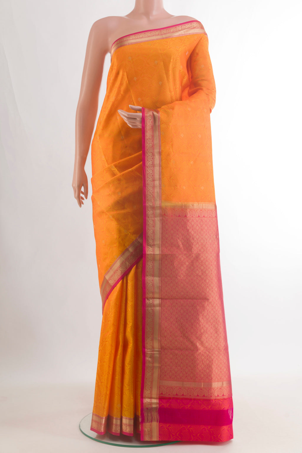 Pure Silk Orange Kanchipuram Saree with Jacquard With Zari Butta on the body and Zari Border.  displayed on a mannequin