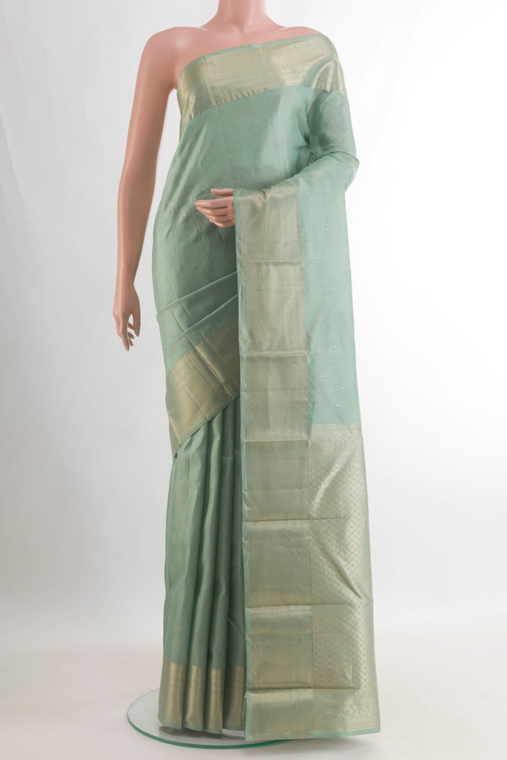 Pure Silk Sage Green Kanchipuram Saree with Stripes on the body and Zari Border.  displayed on a mannequin