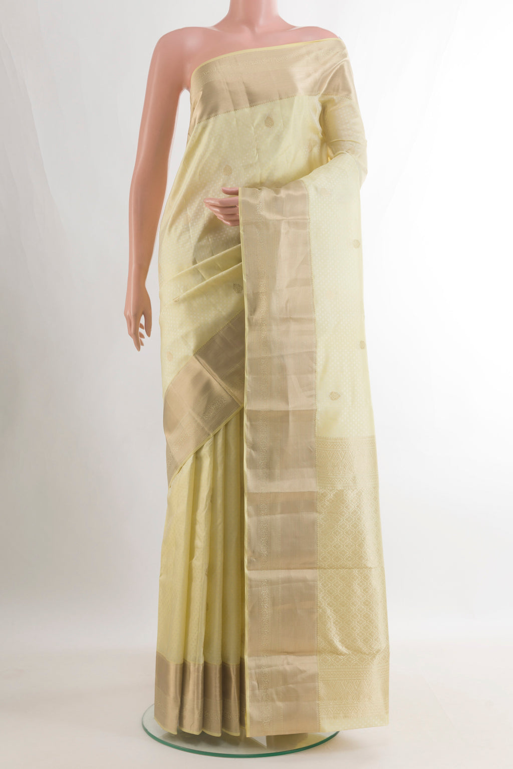 Pure Silk Cream Kanchipuram Saree with Jacquard With Zari Butta on the body and Zari Border.  displayed on a mannequin