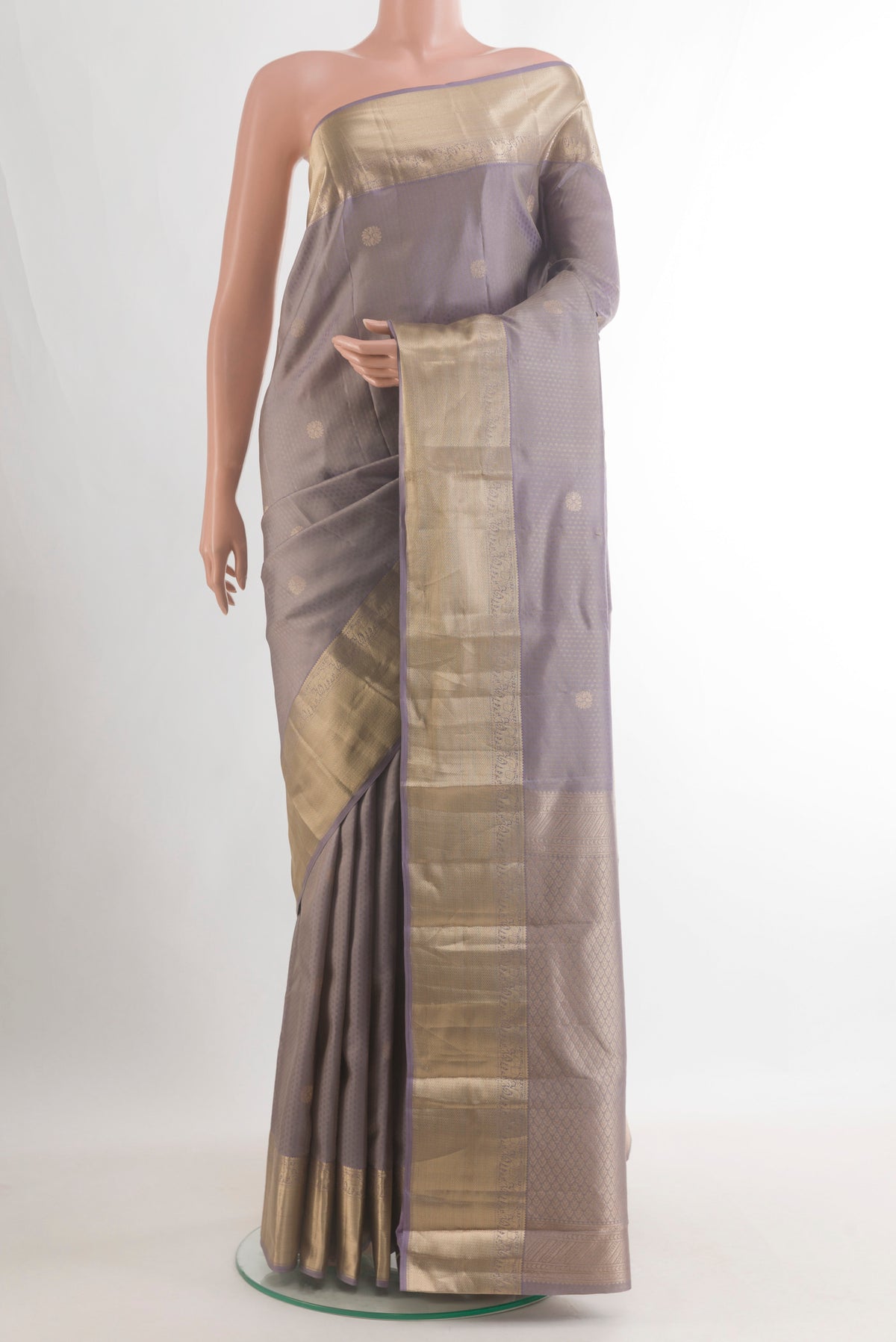 Pure Silk Davys Grey Kanchipuram Saree with Jacquard With Zari Butta on the body and Zari Border.  displayed on a mannequin