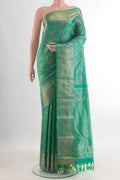 Pure Silk Green Kanchipuram Saree with Zari Brocade on the body and Zari Border.  displayed on a mannequin