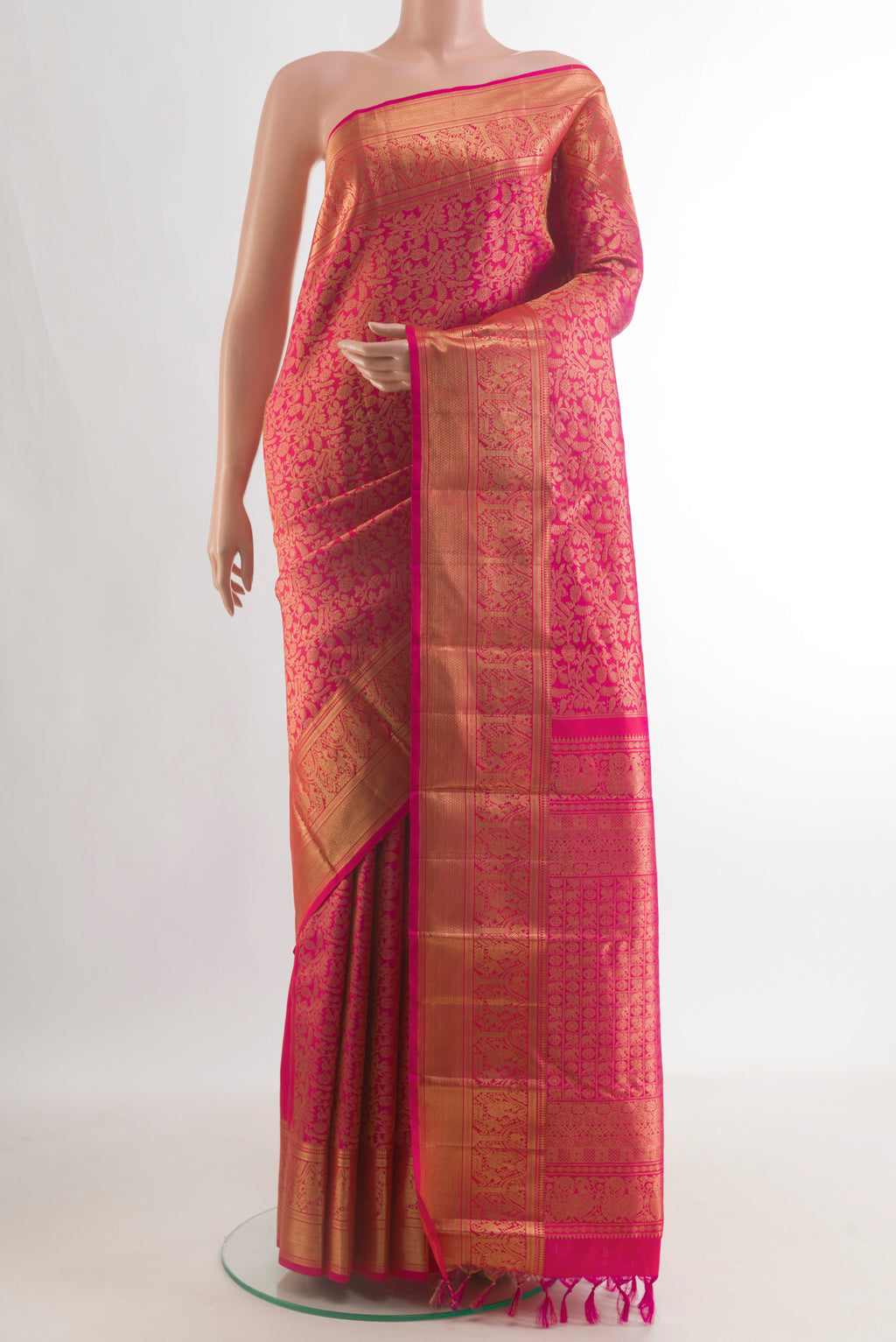 Pure Silk Pink Kanchipuram Saree with Zari Brocade on the body and Zari Border.  displayed on a mannequin