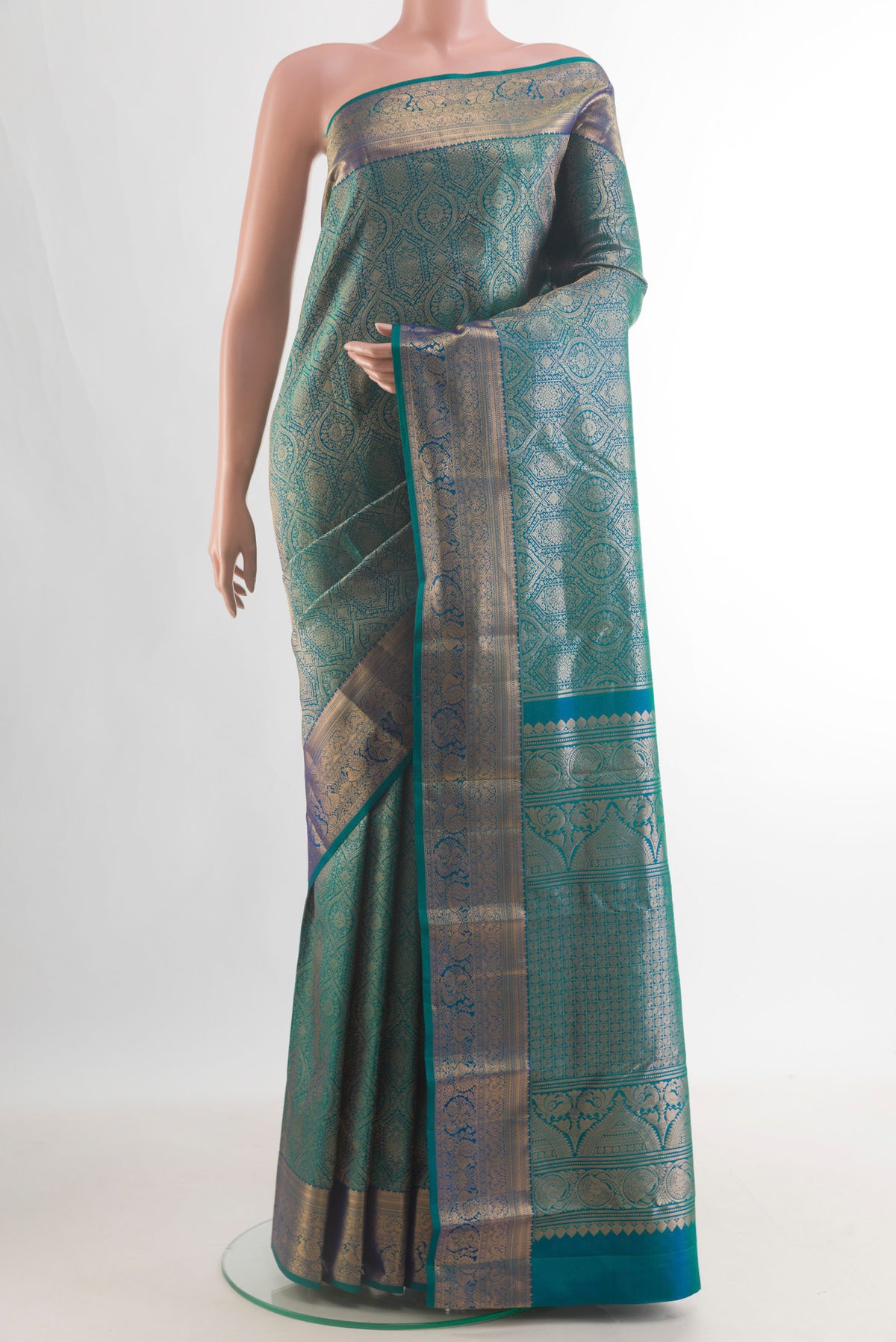 Pure Silk Peacock Blue Dual Tone Kanchipuram Saree with Zari Brocade on the body and Zari Border.  displayed on a mannequin