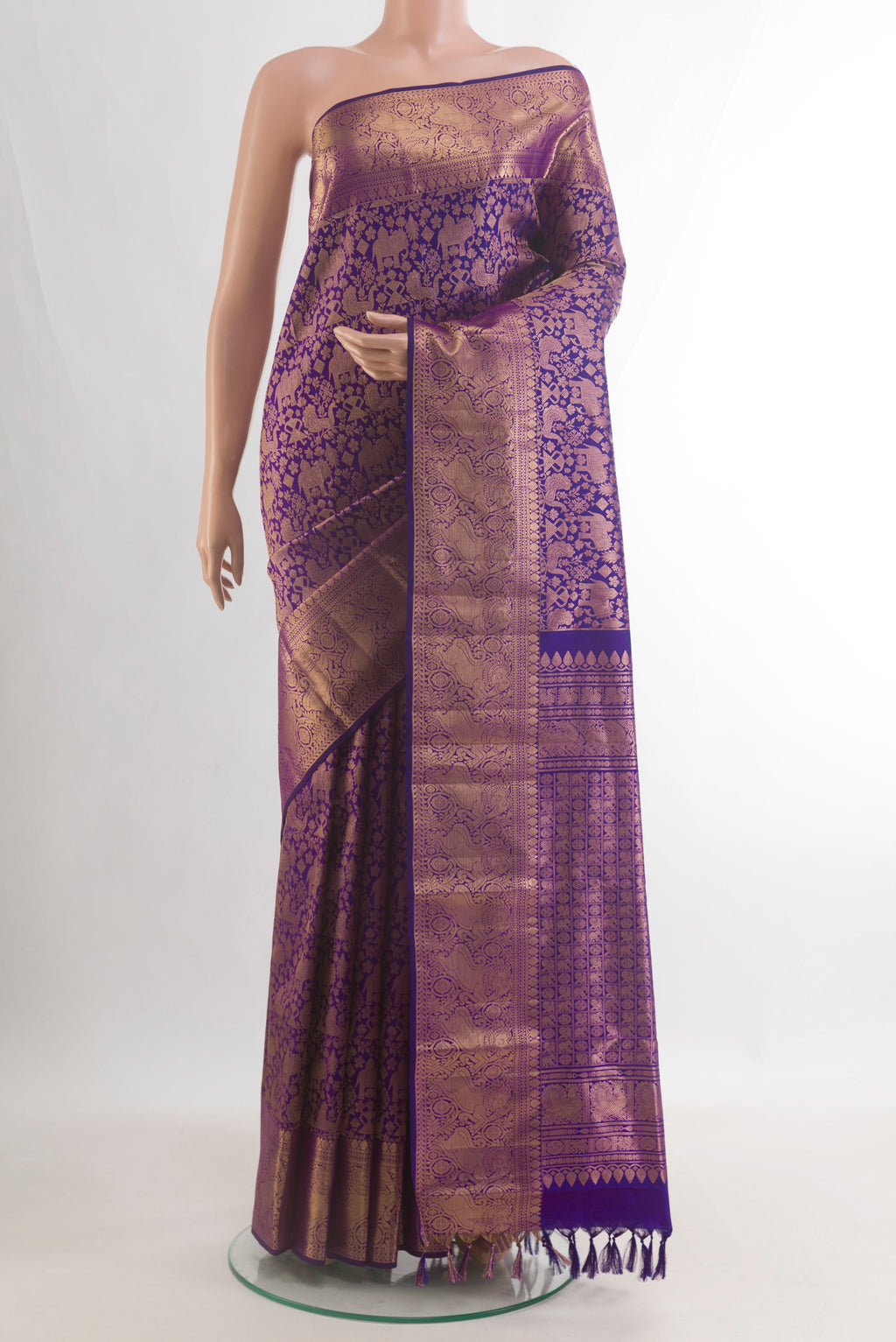 Pure Silk Violet Kanchipuram Saree with Zari Brocade on the body and Zari Border.  displayed on a mannequin