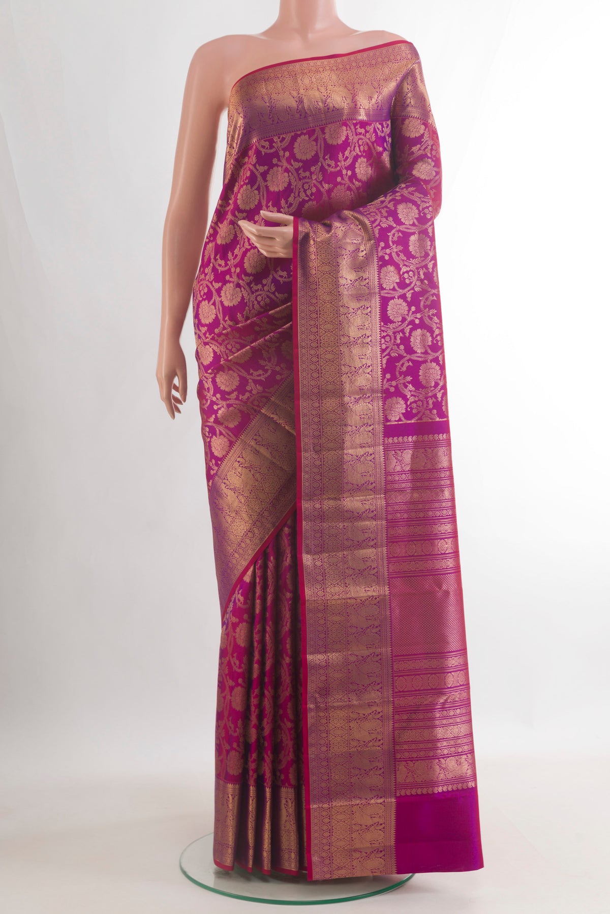Pure Silk Purple Kanchipuram Saree with Zari Brocade on the body and Zari Border.  displayed on a mannequin