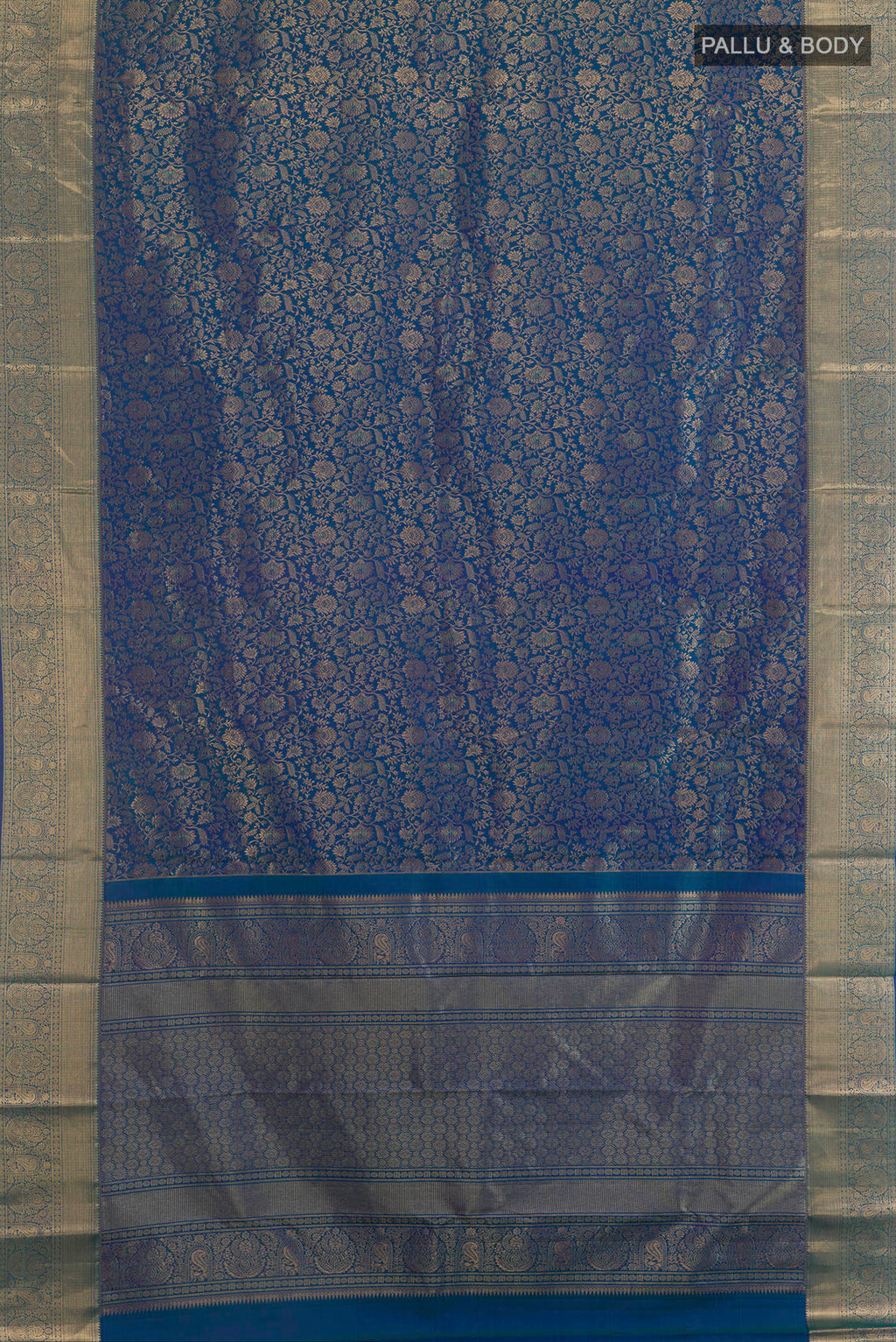 Flat view of Pure Silk Peacock Blue Dual Tone Kanchipuram Saree with Zari Brocade on the body and Zari Border. 