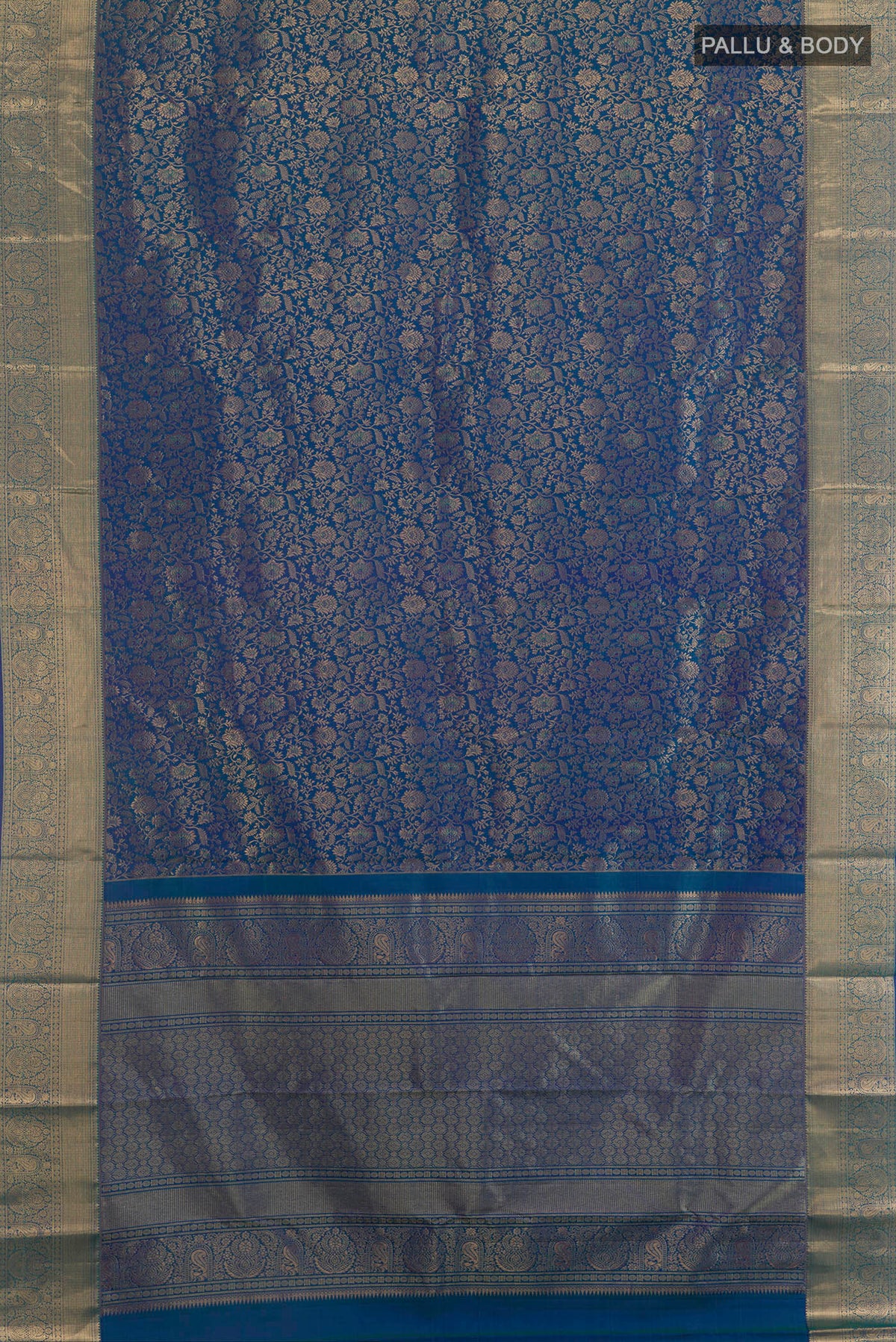 Flat view of Pure Silk Peacock Blue Dual Tone Kanchipuram Saree with Zari Brocade on the body and Zari Border. 