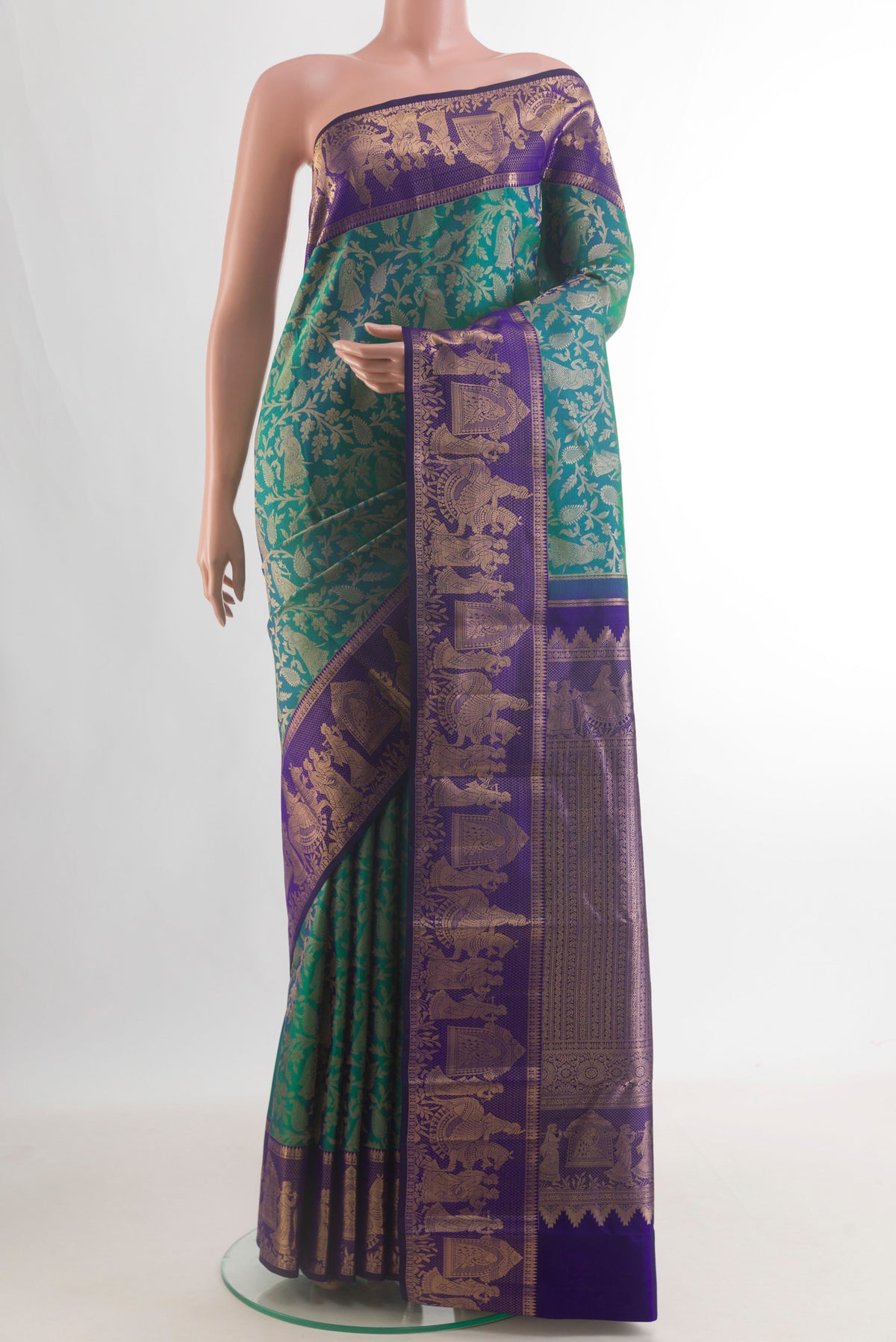 Pure Silk Sea Green Dual Tone Kanchipuram Saree with Zari Brocade on the body and Fancy Border.  displayed on a mannequin