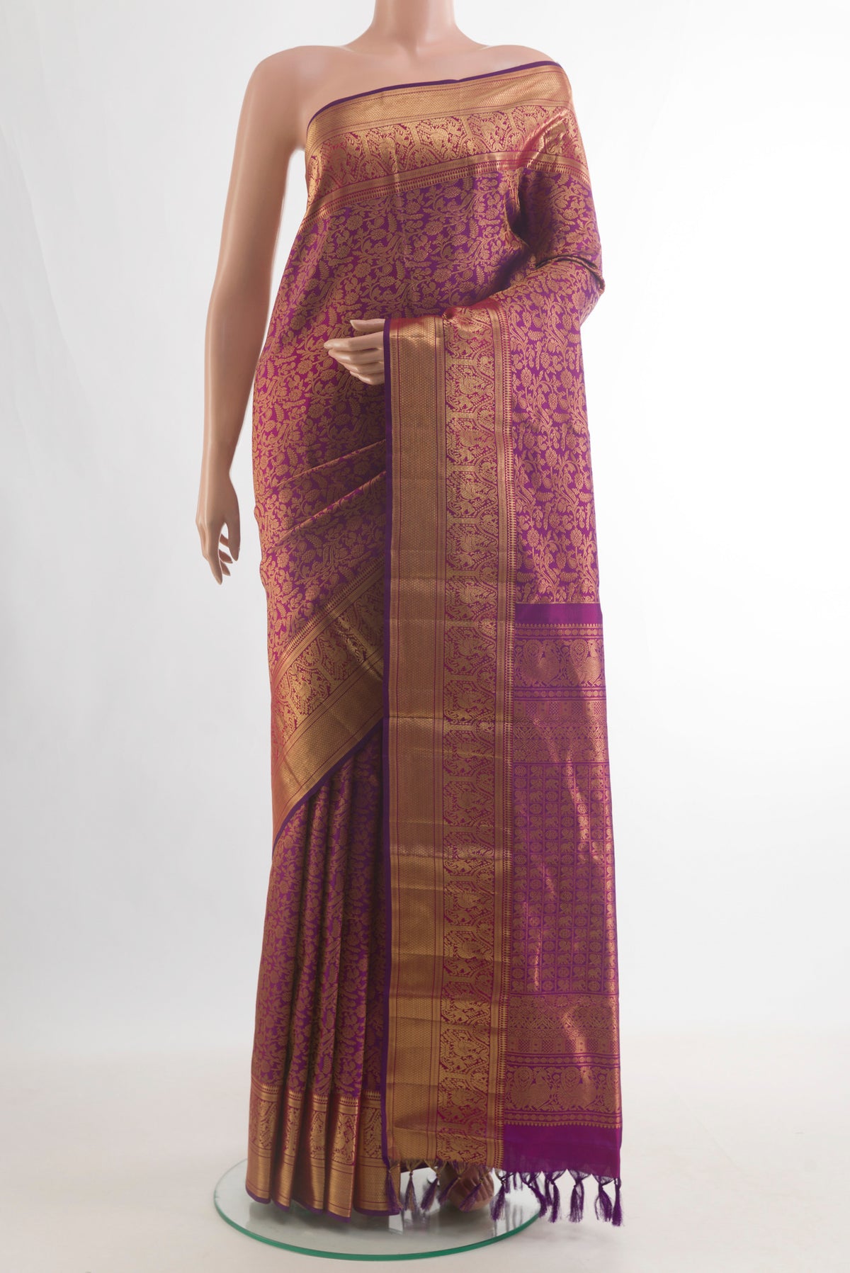 Pure Silk Purple Kanchipuram Saree with Zari Brocade on the body and Zari Border.  displayed on a mannequin