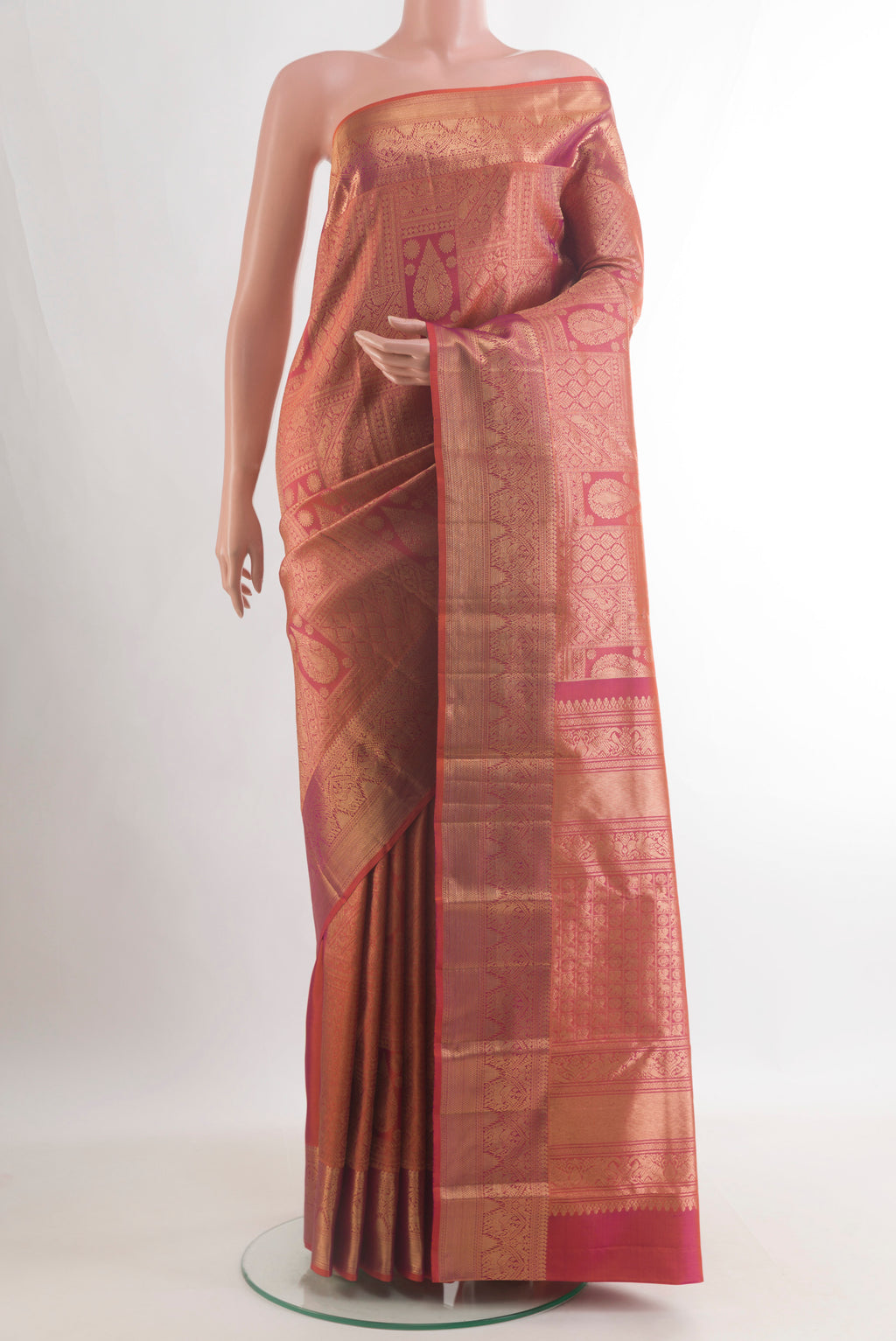 Pure Silk Brick Orange with Magenta Color Kanchipuram Saree with Zari Brocade on the body and Zari Border.  displayed on a mannequin