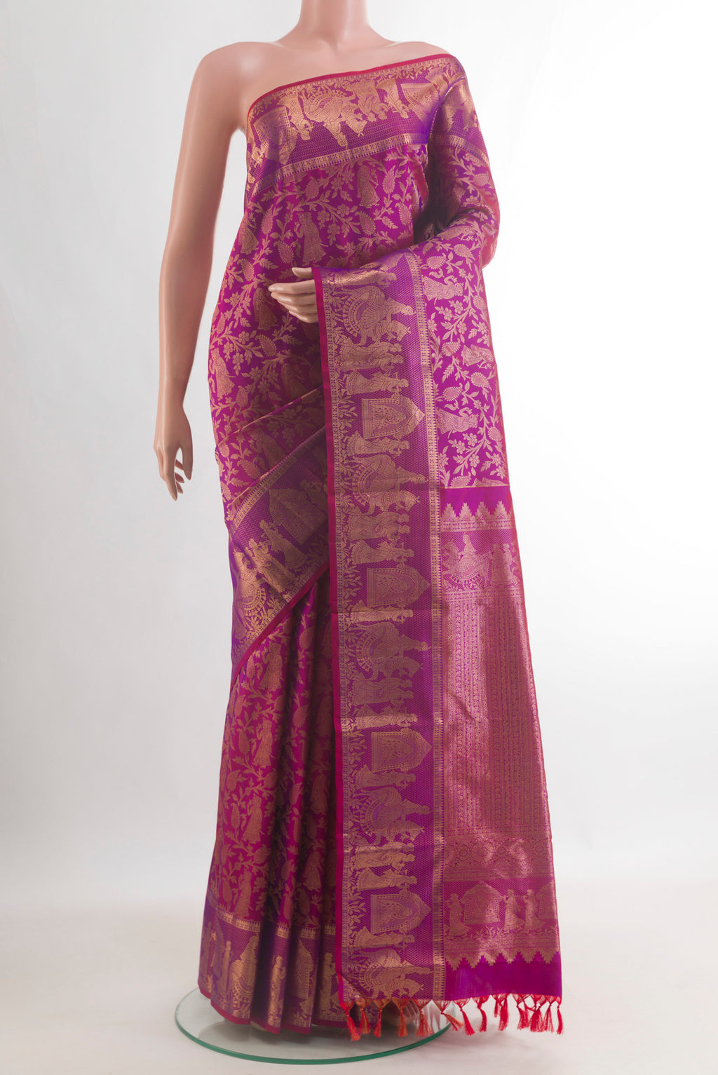 Pure Silk Magenta Kanchipuram Saree with Zari Brocade on the body and Fancy Border.  displayed on a mannequin