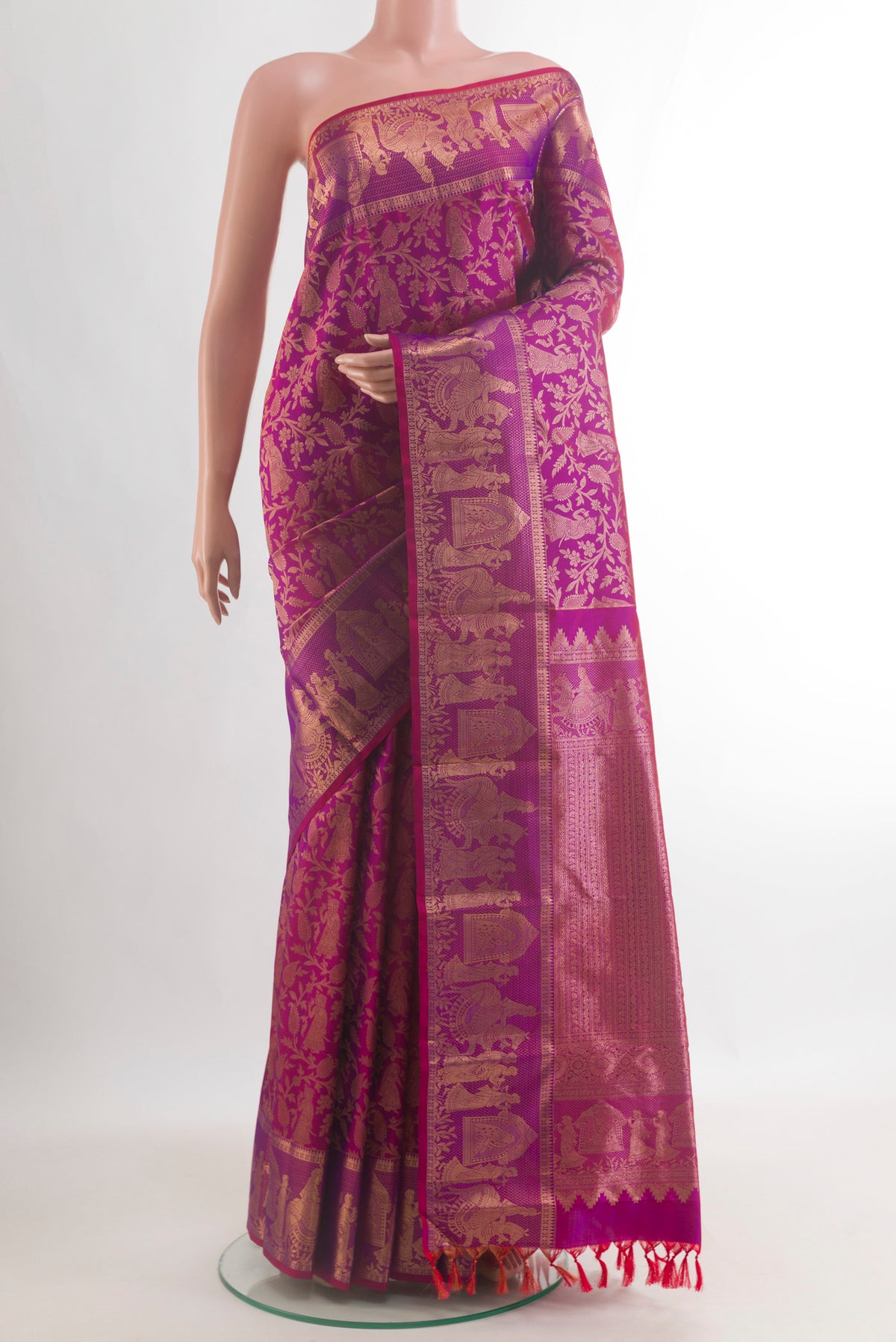 Pure Silk Magenta Kanchipuram Saree with Zari Brocade on the body and Fancy Border.  displayed on a mannequin
