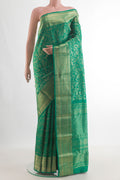 Pure Silk Green Kanjivaram Saree with Zari Brocade on the body and Zari Border.  displayed on a mannequin