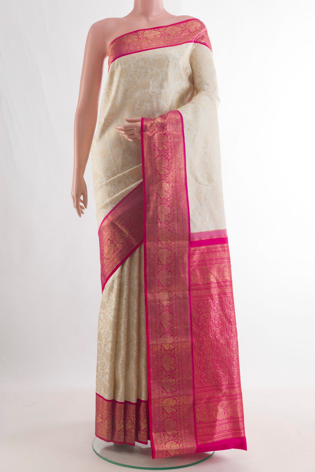 Pure Silk Off White Kanjivaram Saree with Zari Brocade on the body and Zari Border.  displayed on a mannequin