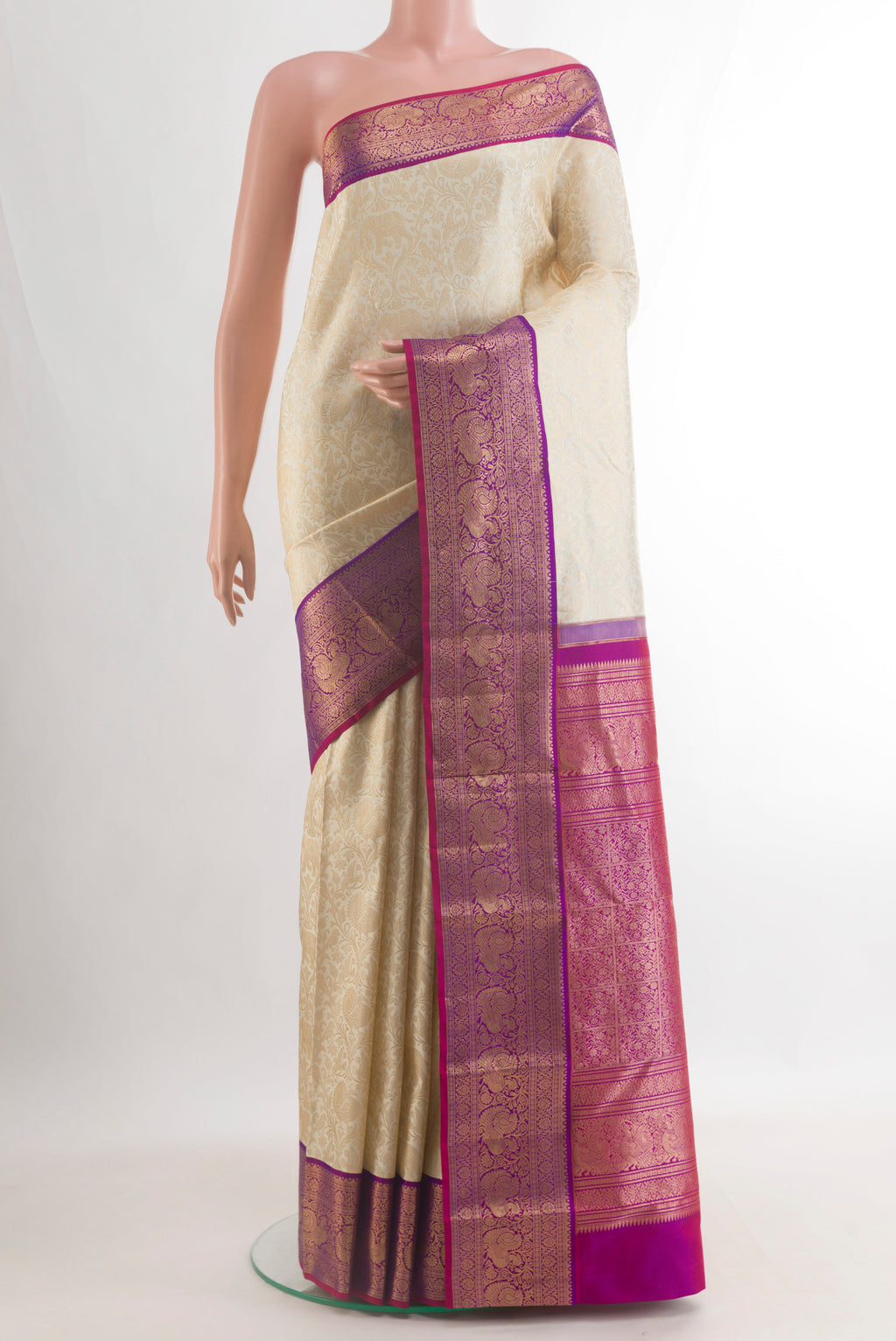 Pure Silk Off White Kanjivaram Saree with Zari Brocade on the body and Zari Border.  displayed on a mannequin