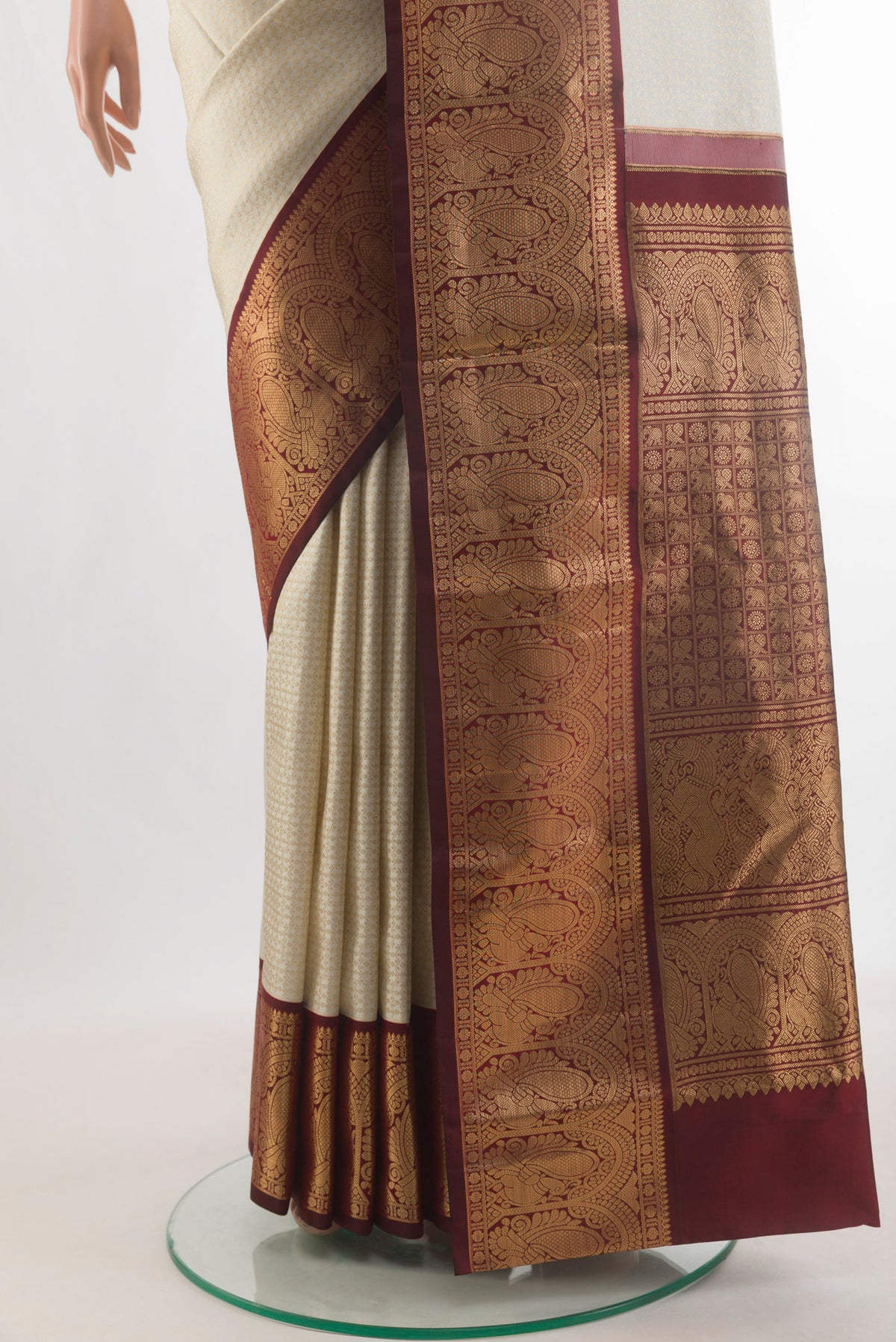 Pleats and pallu of Pure Silk Off White Kanjivaram Saree with Zari Brocade on the body and Zari Border. 
