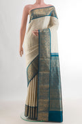 Pure Silk Off White Kanjivaram Saree with Zari Brocade on the body and Zari Border.  displayed on a mannequin