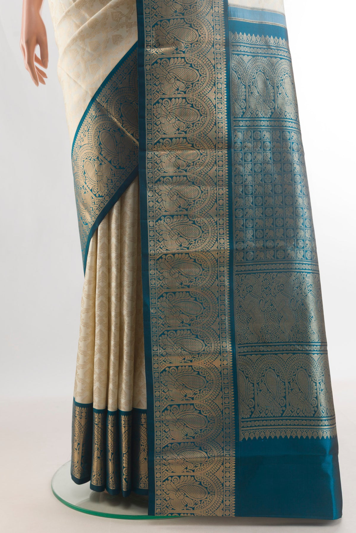 Pleats and pallu of Pure Silk Off White Kanjivaram Saree with Zari Brocade on the body and Zari Border. 