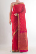 Pure Silk Red Kanchipuram Saree with Zari Butta on the body and Zari Border.  displayed on a mannequin