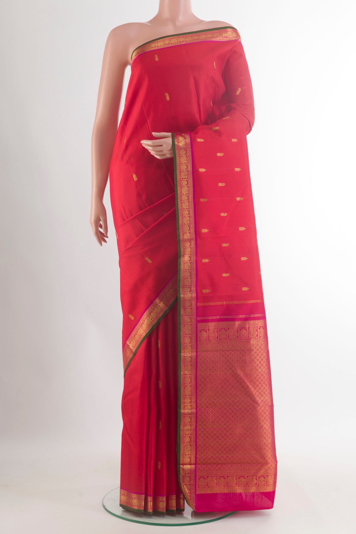 Pure Silk Red Kanchipuram Saree with Zari Butta on the body and Zari Border.  displayed on a mannequin